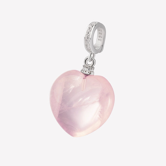 Heart-shaped pink crystal pendant with silver and rhinestone accents on a white background